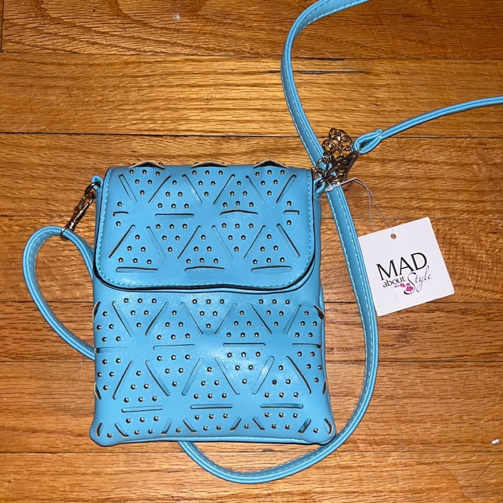 NEVER USED , TAGS STILL ON. Blue cross body purse